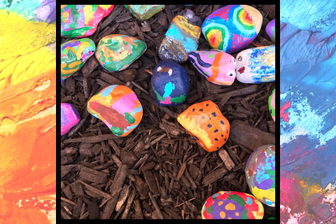 A photo of colorful painted rocks. 