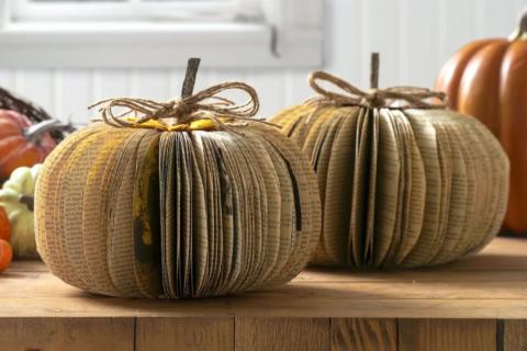 Image of two pumpkins made out of book pages. 