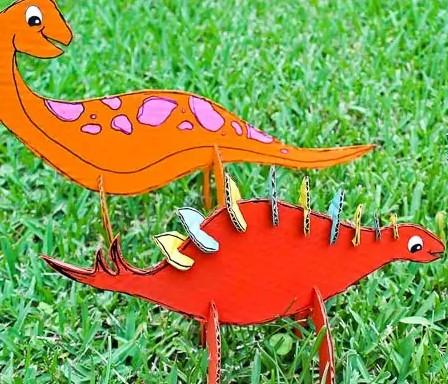 Cardboard dinos in grass