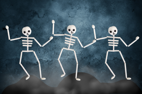 skeletons made from paper straws and pompoms